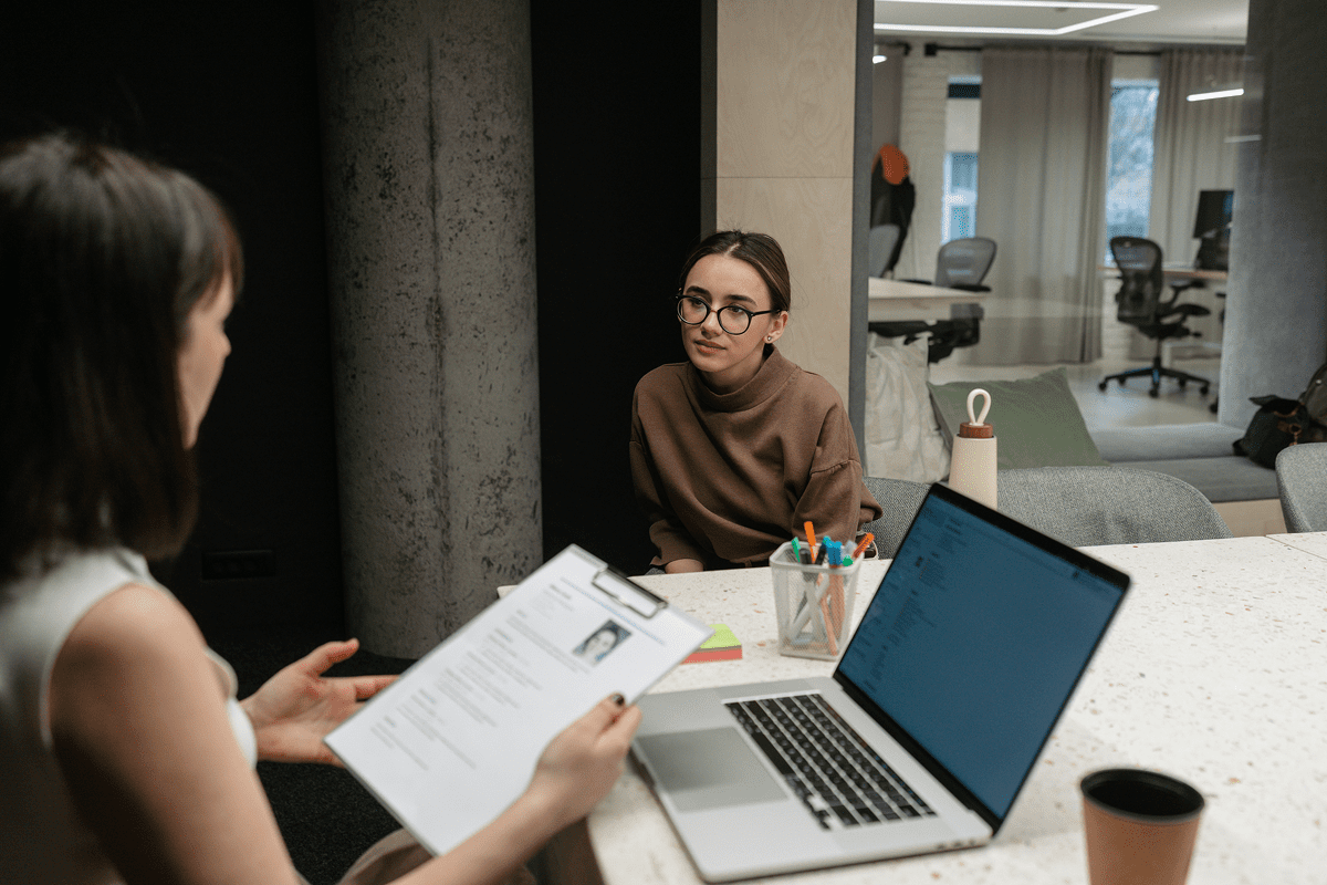 Candidate being interviewed at office desk
