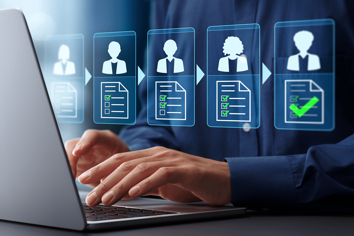 Recruiter reviewing digital candidate profiles on laptop