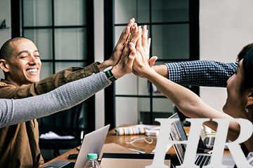 Group teamwork with high-five gesture